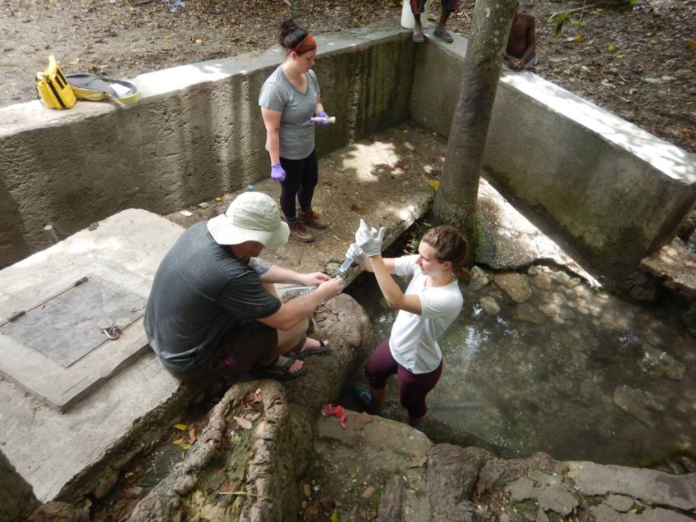 Dr. Ryan Vannier, Maria Beelen, and MacKenzie Kraft taking water samples near Bastien, Haiti